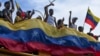 Manifestantes protestan contra los resultados oficiales de las elecciones que declaran la reelección del presidente Nicolás Maduro en Valencia, Venezuela. (AP/Jacinto Oliveros)