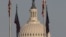 US National Guard soldiers look out at the National Mall from an observation deck at the US Capitol